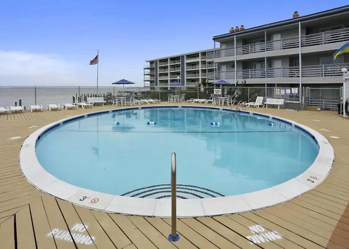 Inviting Bayfront Escape With Outdoor Seating Pool And Great Location